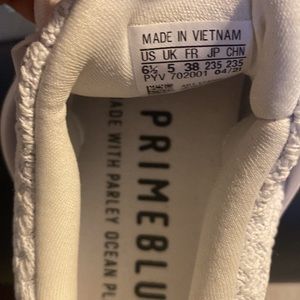 Adidas ultra boost.  White with gold trim.